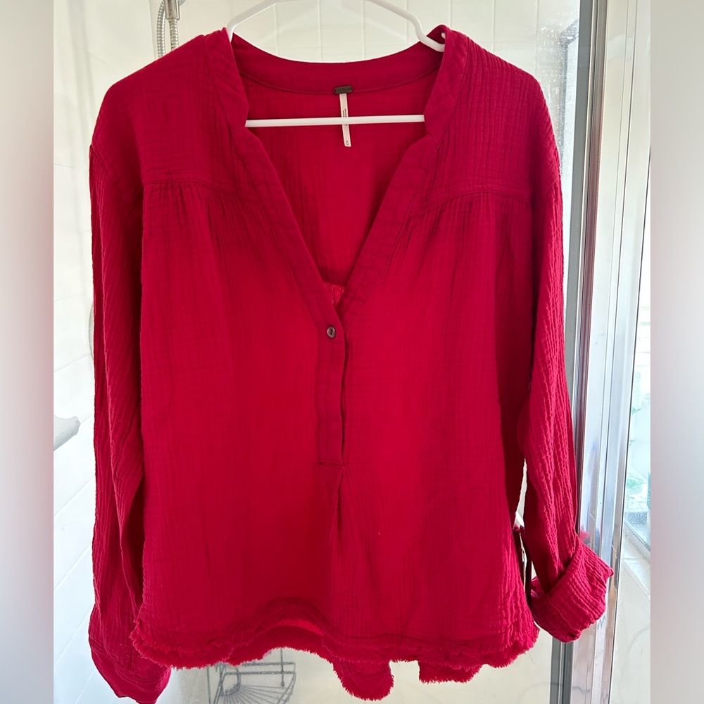 Free People Women’s v-neck, long sleeve shirt. Size Med, fits more like a L-XL